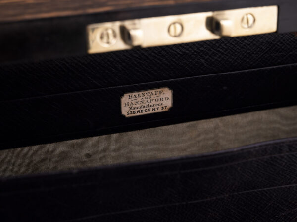 Close up of the makers label in the Coromandel Jewellery Box by Halstaff & Hannaford