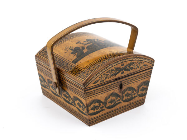 Penwork sewing basket with shaped handle front side view