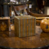 Scottish Mauchline Ware Tea Caddy on table with other caddies