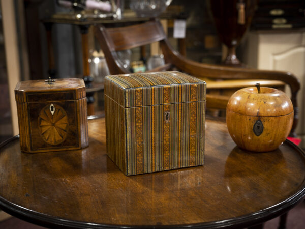 Scottish Mauchline Ware Tea Caddy on table with other caddies