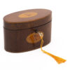 oval tea caddy with tasselled key