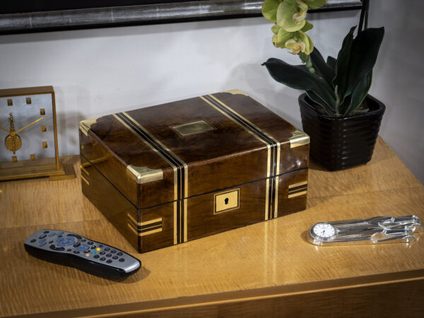 walnut jewellery box on display on a table