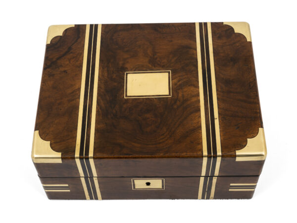 walnut jewellery box on white background top down