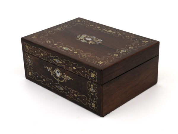 rosewood jewellery box on white background