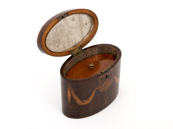 oval tea caddy with floating lid
