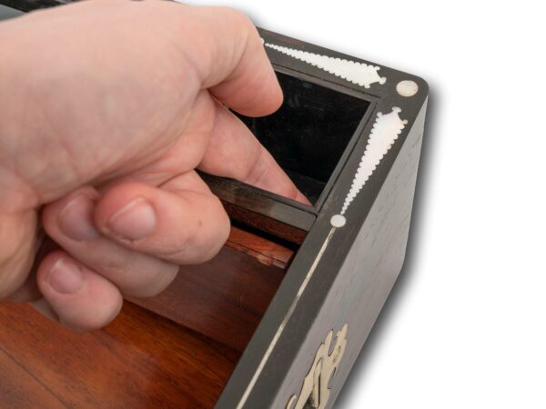 View of the secret drawer button
