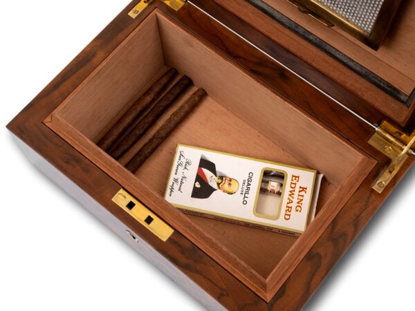 Humidor in a decorative setting with fitted cigars