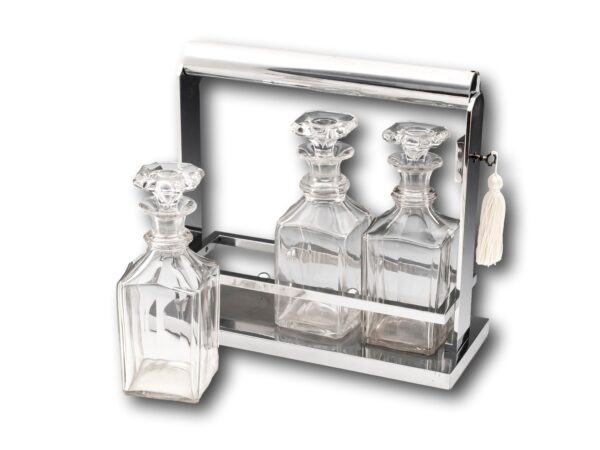 Front Overview of the Jacques Adnet Art Deco Tantalus with the key inserted and one bottle removed