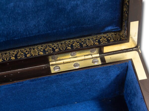 Close up of the good quality hinges and brass inlay