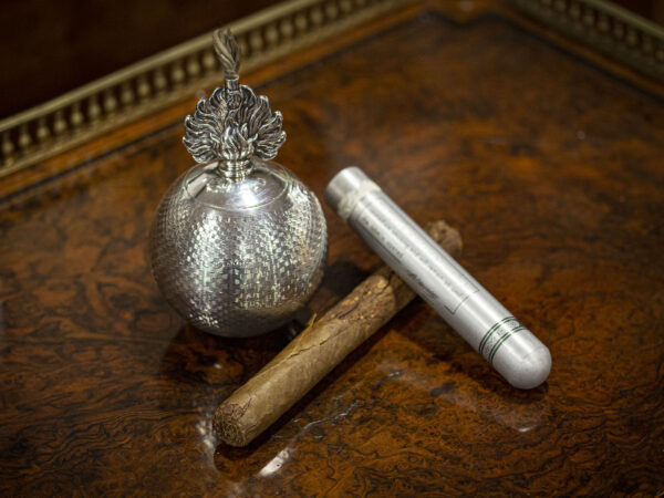 Decorative shot with cigars showing the use of the lighter