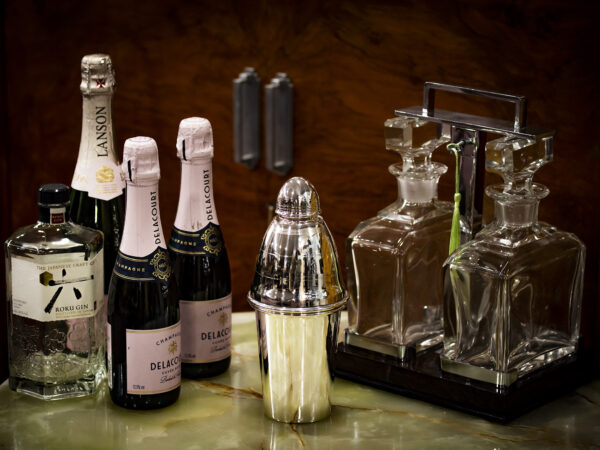 Cocktail Shaker in a decorative collectors setting for scale
