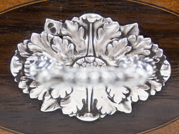 Close up of the decorative silver handle