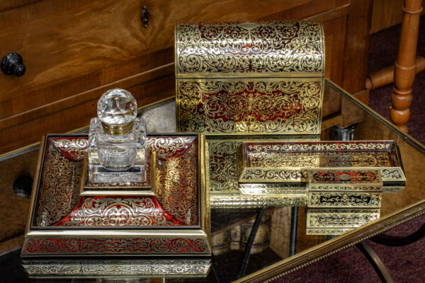 Inkstand in a decorative collectors setting with other Boulle pieces