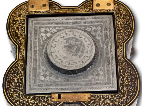 Close up of the engraved pewter tea caddy