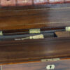 Close up of the ink wells and the key within the pen tray