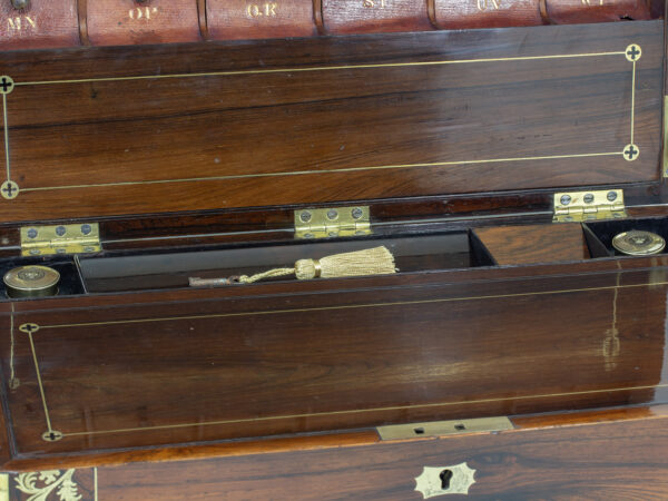 Close up of the ink wells and the key within the pen tray
