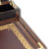 Close up of the brass pin in its housing to the right of the box