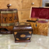 Edwardian Sarcophagus Tea Caddy in a decorative collectors setting with other tea caddies.