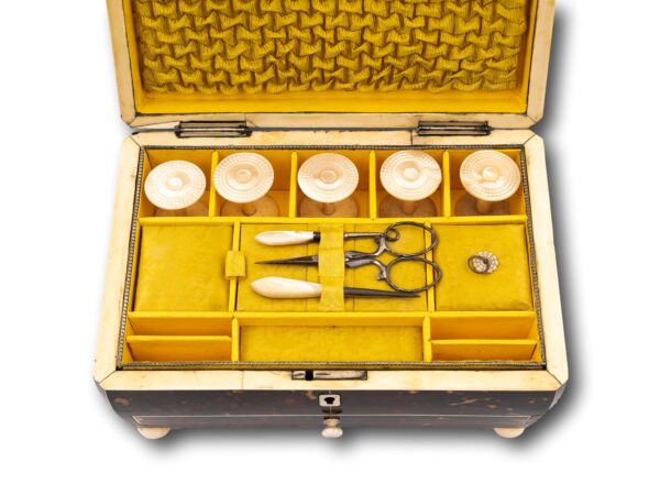 Close up of the top partitioned section in the Regency Tortoiseshell Sewing Box