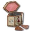 Overview of the Paper Scroll tea caddy with the lid up and floating lids removed