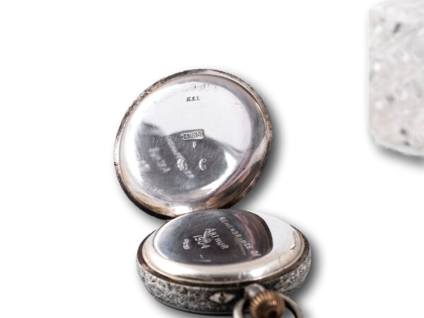 View of the continental 935 silver hallmarks in the rear lid of the pocket watch