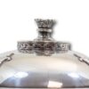Close up of the domed silver lid and finial