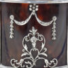 Close up of the applied silver decoartion