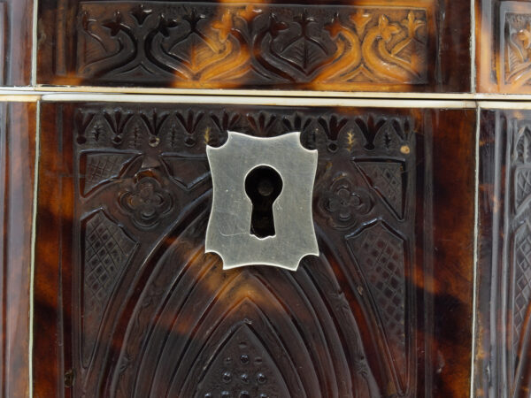 Close up of the silvered escutcheon
