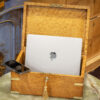 Overview of the Birdseye Maple Jewellery Box in a decorative setting with a laptop and phone placed inside