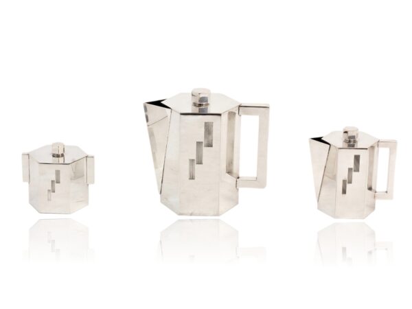 Side of the tea pot, milk just and sugar bowl without the tray