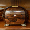 Overview of the Rosewood Tea Caddy in a decorative collectors setting