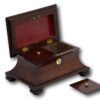 Overview of the mahogany tea caddy with the lid up and caddy lids removed
