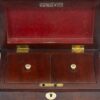 Overview of the mahogany tea caddy with the lid up and tea caddy lids shown