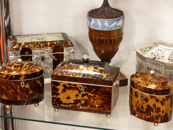 Overview of the Regency Tortoiseshell Tea Caddy with matching pair of oval shaped tea caddies, a great complimenting set.