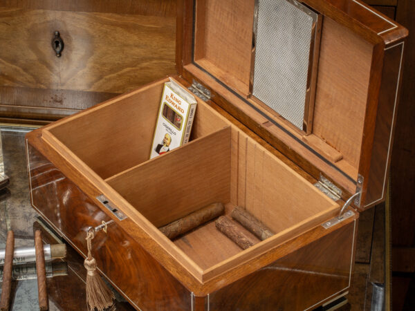 Close up of the Dunhill Humidor with the lid up in a decorative collectors setting