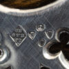 Close up of the sterling silver George Betjemann London 1877 Hallmarks