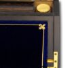 Close up of the gold tooling, greek key and fleur-de-lis decoration