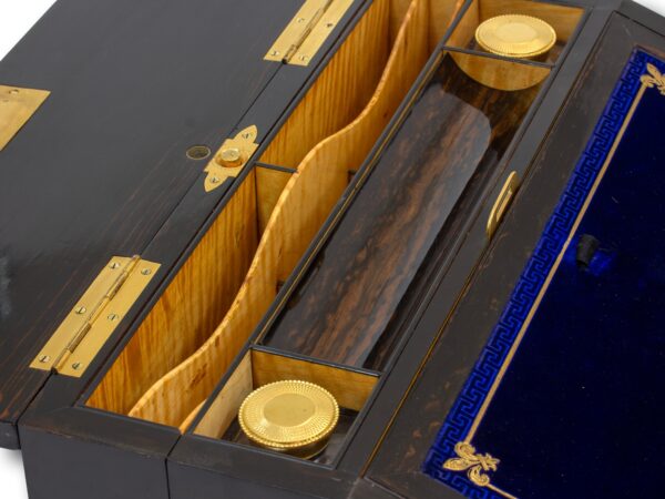 Close up of the satinwood partitions, inkwell and pen tray to the rear