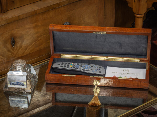 Front overview of the Mahogany Accessories Box in a decorative collectors setting