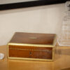 Overview of the Anglo Indian Amboyna Box in a decorative collectors setting