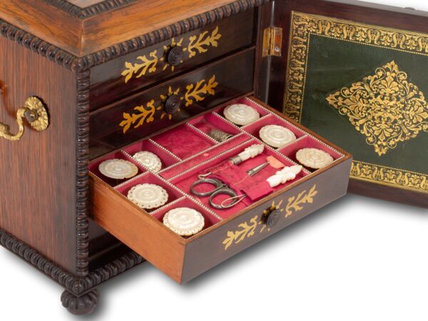 Close up of the second drawer filled with mother of pearl sewing kit