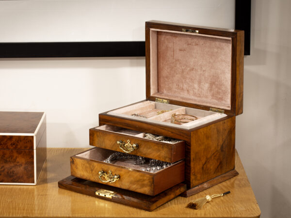 Front overview of the Victorian Walnut Jewellery Box in a decorative collectors setting.