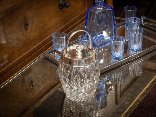 Asprey Silver and Glass Ice Bucket in a decorative setting