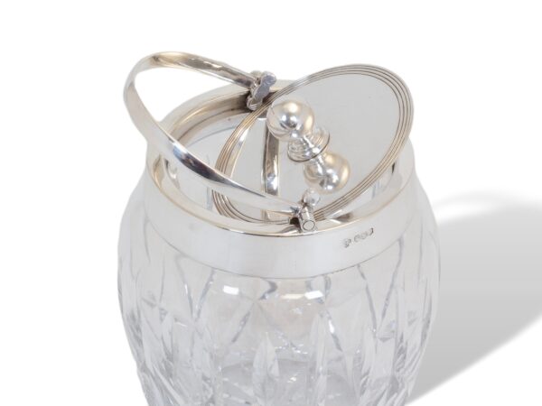 Removing the lid on the Asprey Silver and Glass Ice Bucket