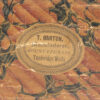 Close up of the T. Barton makers label