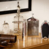 Novelty Silver Plate Telescope Flask in a decorative collectors setting