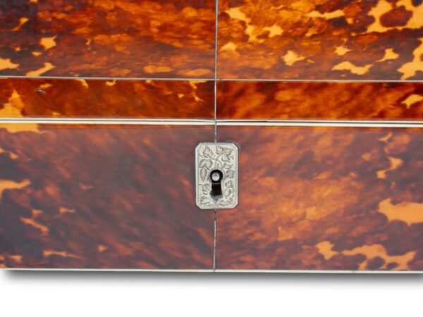 Close up of the escutcheon on the Tortoiseshell and Mother of Pearl Sewing Box
