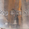 Close up of the sterling silver hallmarks on the collar of the decanter from the Stamford Bridge Tantalus Hukin & Heath