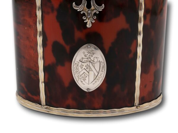 Close up of the family crest on the Silver Gilt Oval Red Tortoiseshell Tea Caddy