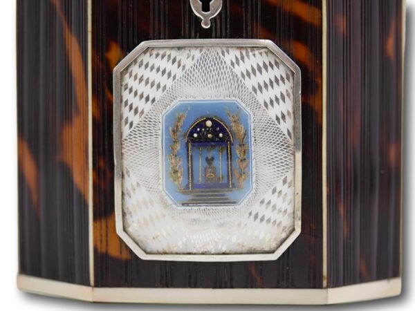 Close up of the glazed panel on the front of the Pressed Tortoiseshell Tent Top Tea Caddy